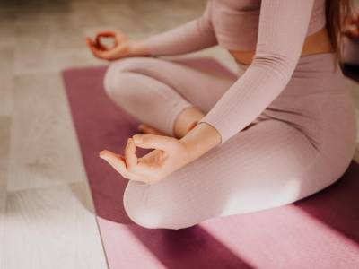 well-looking-middle-aged-sporty-woman-fitness-instructor-pink-sportswear-doing-stretching